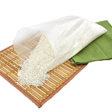 High Density Food Storage Bag, 10" x 14", Open Bag With Rice Grains Spilling Onto A Place Mat